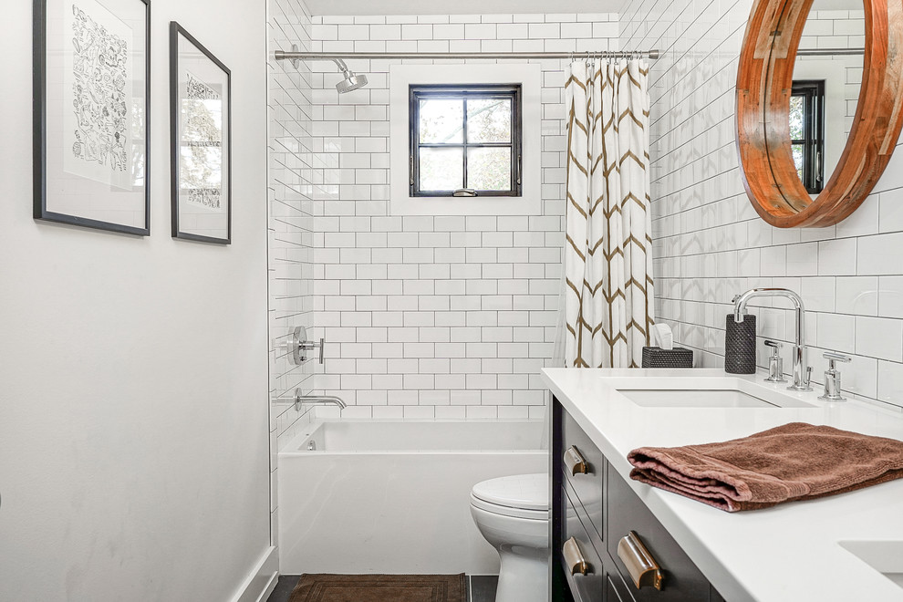 Design ideas for a transitional 3/4 bathroom in Philadelphia with flat-panel cabinets, black cabinets, an alcove tub, a shower/bathtub combo, white tile, subway tile, white walls, an undermount sink, grey floor, a shower curtain and white benchtops.