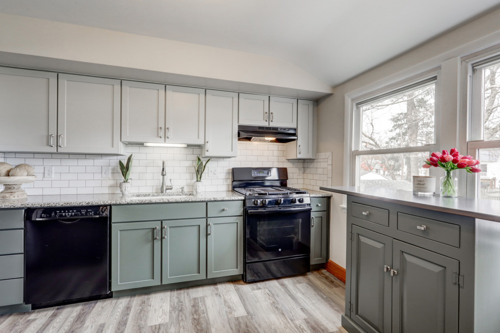 Inspiration for a mid-sized transitional l-shaped eat-in kitchen remodel with recessed-panel cabinets, green cabinets and a peninsula