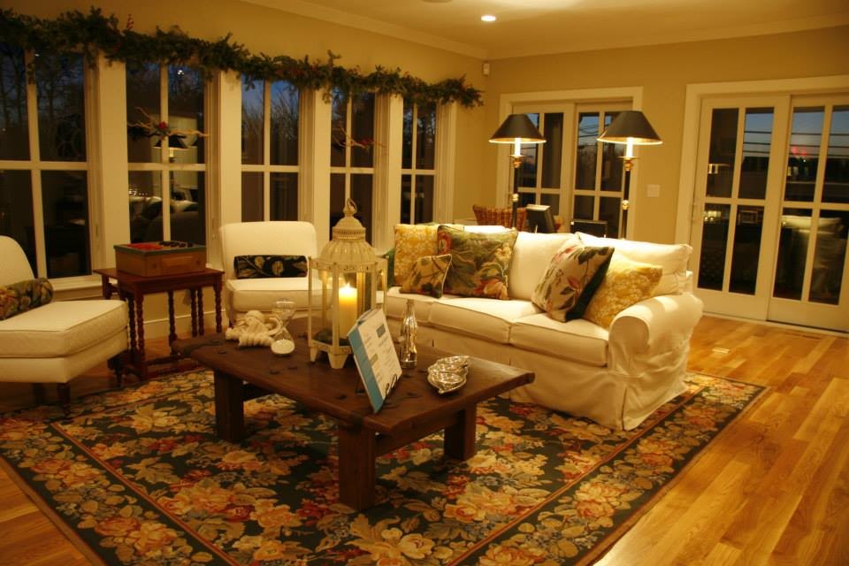 Large traditional living room in Boston with beige walls and medium hardwood floors.