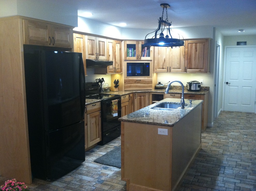 Eat-in kitchen - mid-sized rustic l-shaped ceramic tile eat-in kitchen idea with an undermount sink, raised-panel cabinets, light wood cabinets, quartz countertops, black appliances and an island
