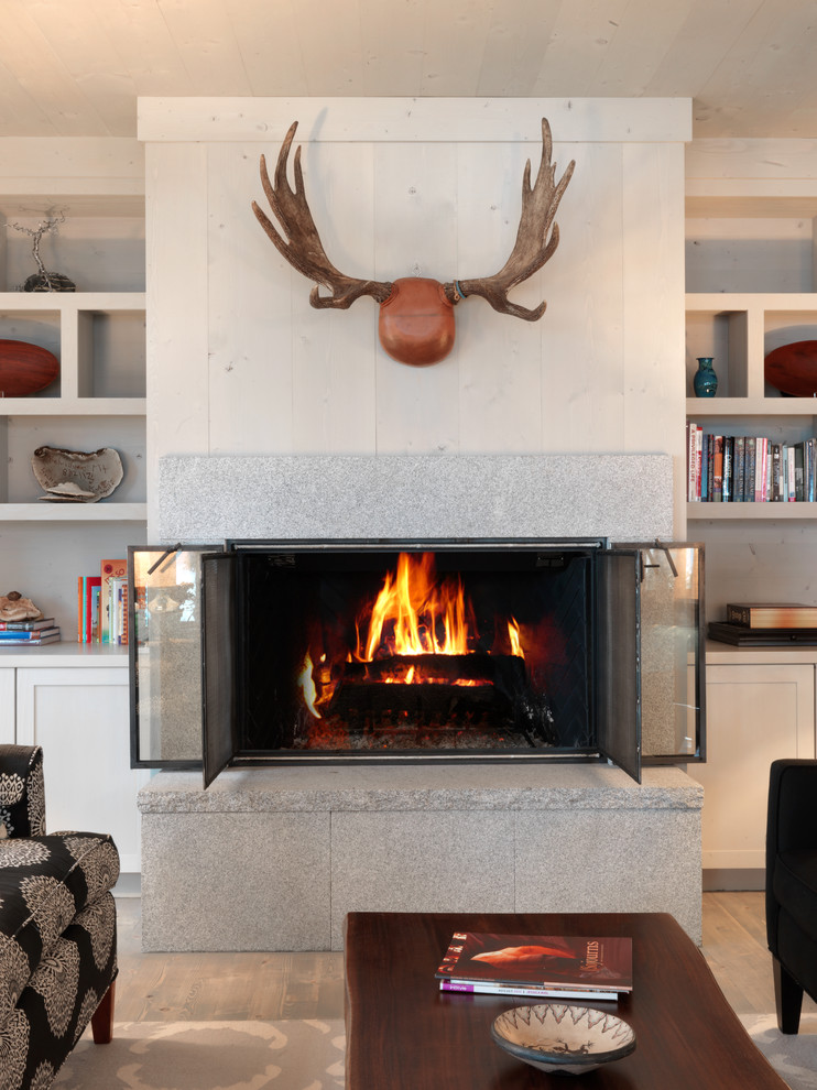 This is an example of a country living room in Burlington with a standard fireplace.