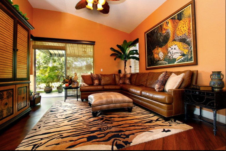 Design ideas for a mid-sized eclectic formal enclosed living room in Miami with yellow walls and dark hardwood floors.