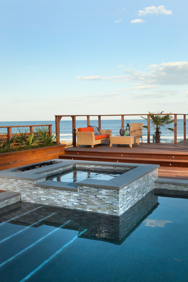 Design ideas for a contemporary pool in Wilmington with decking.