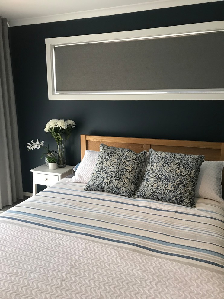 Design ideas for an eclectic master bedroom in Melbourne with blue walls, carpet and grey floor.