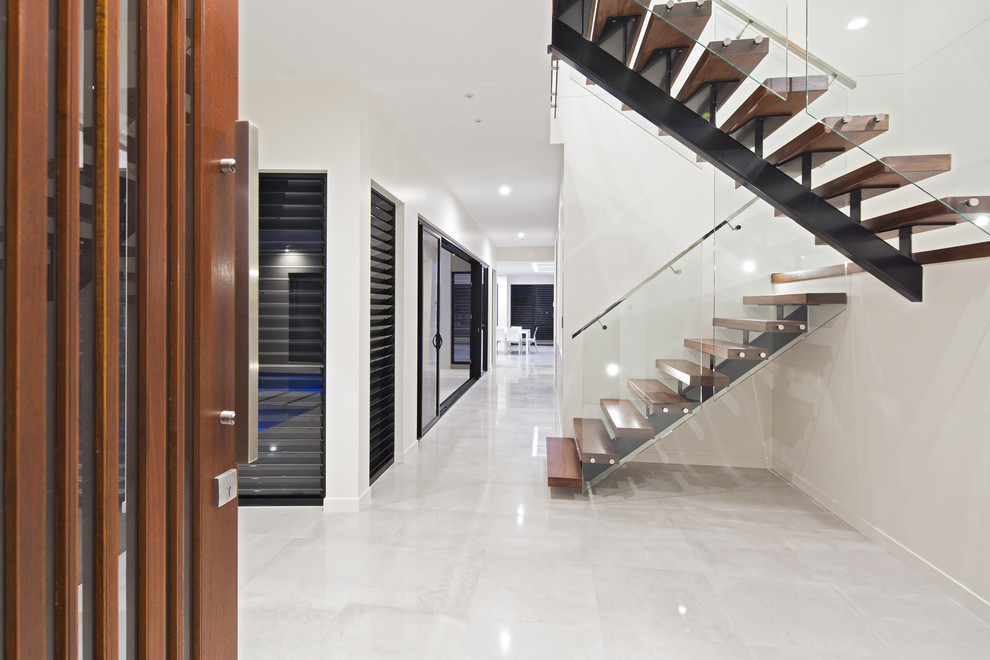 Contemporary wood u-shaped staircase in Brisbane with open risers.