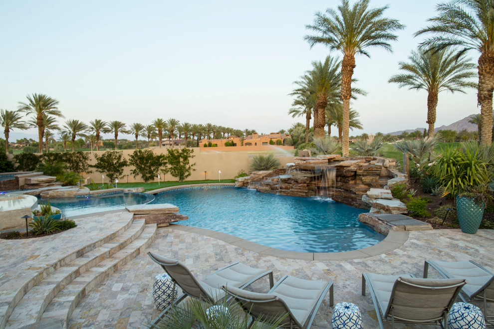 Pool fountain - mid-sized transitional backyard concrete paver and round natural pool fountain idea