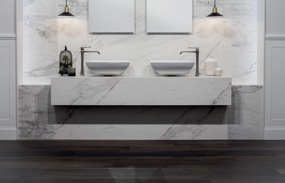 This is an example of a large traditional bathroom in London with porcelain tile.