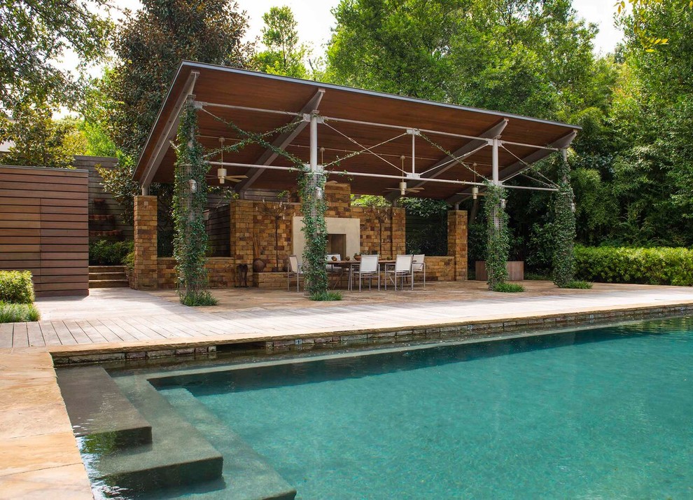 Photo of a large modern backyard garden in Dallas with a water feature and decking.