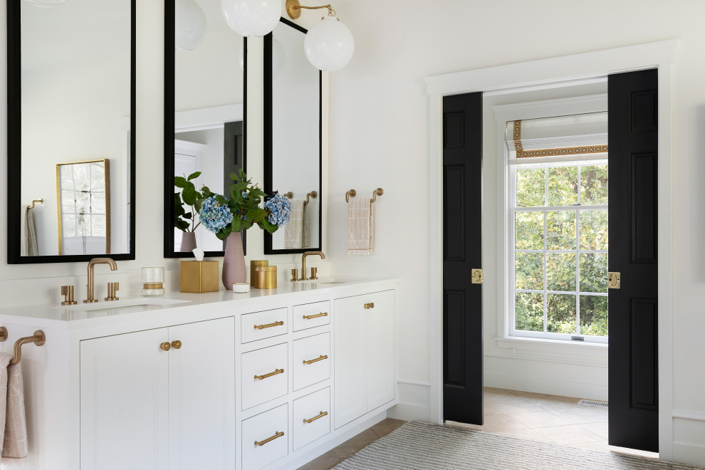 Design ideas for a transitional master bathroom in Minneapolis with recessed-panel cabinets, white cabinets, an undermount tub, a curbless shower, a bidet, beige tile, porcelain tile, white walls, travertine floors, an undermount sink, engineered quartz benchtops, beige floor, an open shower and white benchtops.