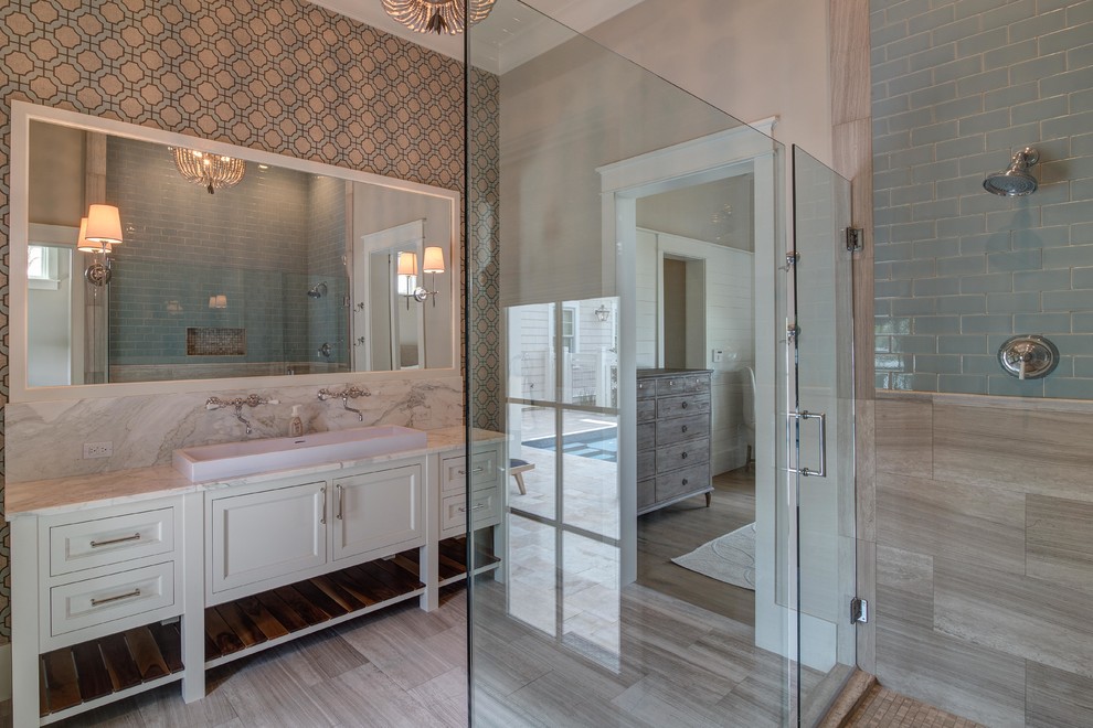 Large transitional master bathroom in Atlanta with a trough sink, white cabinets, marble benchtops, a corner shower, beige walls, marble floors, shaker cabinets, blue tile, stone tile, grey floor and a hinged shower door.