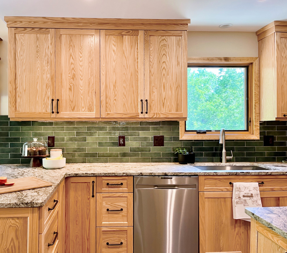 Inspiration for a mid-sized transitional u-shaped vinyl floor and gray floor kitchen pantry remodel with an undermount sink, shaker cabinets, light wood cabinets, granite countertops, green backsplash, porcelain backsplash, stainless steel appliances, a peninsula and gray countertops