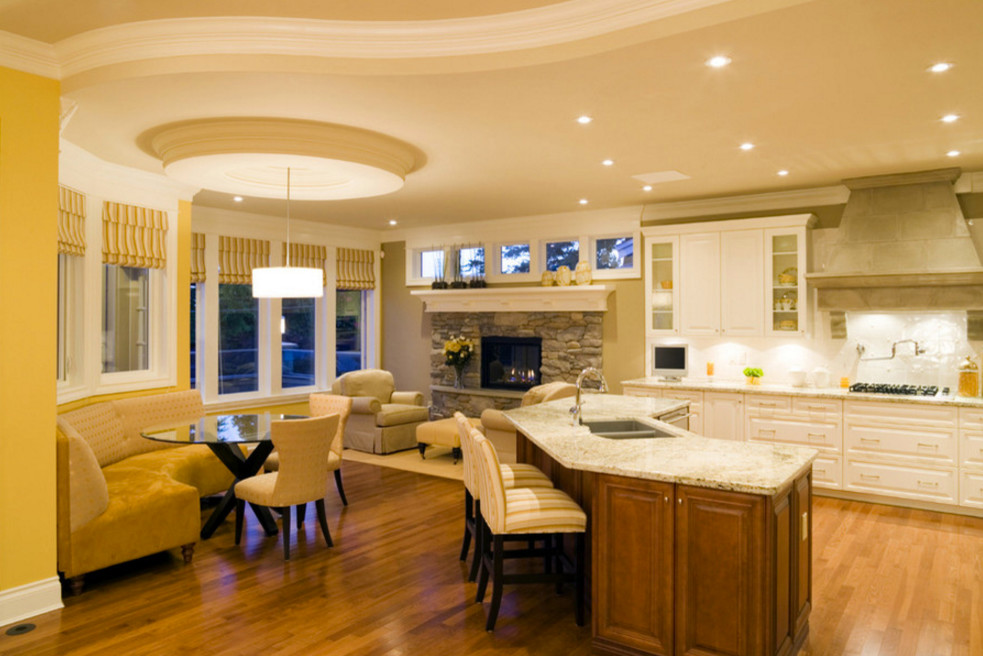 Example of a large transitional l-shaped medium tone wood floor open concept kitchen design in Boston with raised-panel cabinets, white cabinets, white backsplash, an island, a double-bowl sink and granite countertops