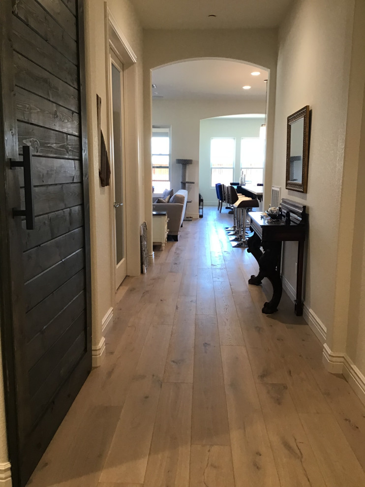 Photo of a mid-sized traditional hallway in Other with beige walls, light hardwood floors, multi-coloured floor and recessed.