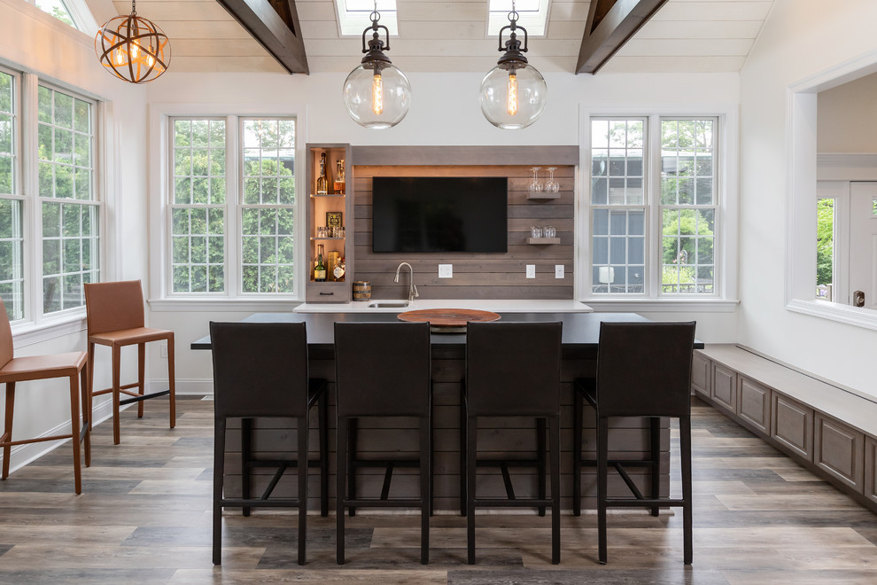 Design ideas for a large country galley wet bar in Philadelphia with brown floor, an undermount sink, open cabinets, medium wood cabinets, brown splashback, timber splashback, medium hardwood floors and white benchtop.