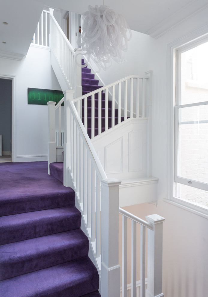 Photo of a traditional carpeted l-shaped staircase in Kent with carpet risers.