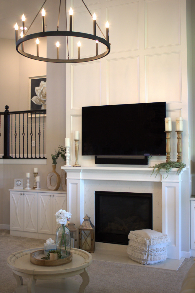 Inspiration for a traditional living room in Columbus with a wooden fireplace surround.