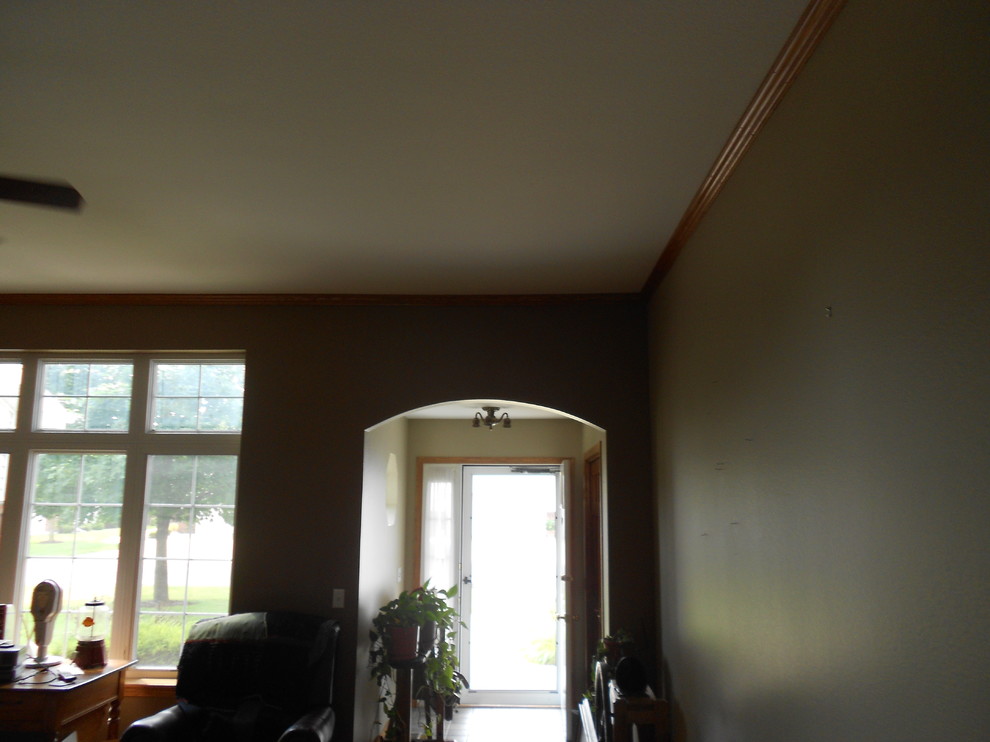 Front door - small transitional light wood floor front door idea with beige walls and a white front door