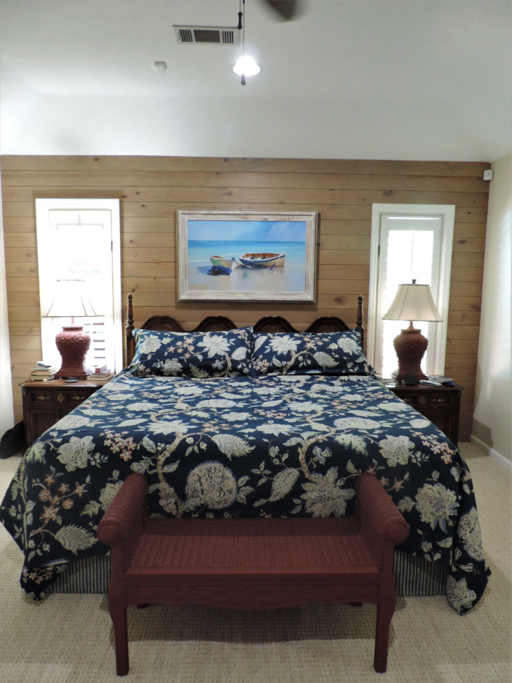 Inspiration for a mid-sized beach style master bedroom in Other with beige walls, carpet, no fireplace and beige floor.
