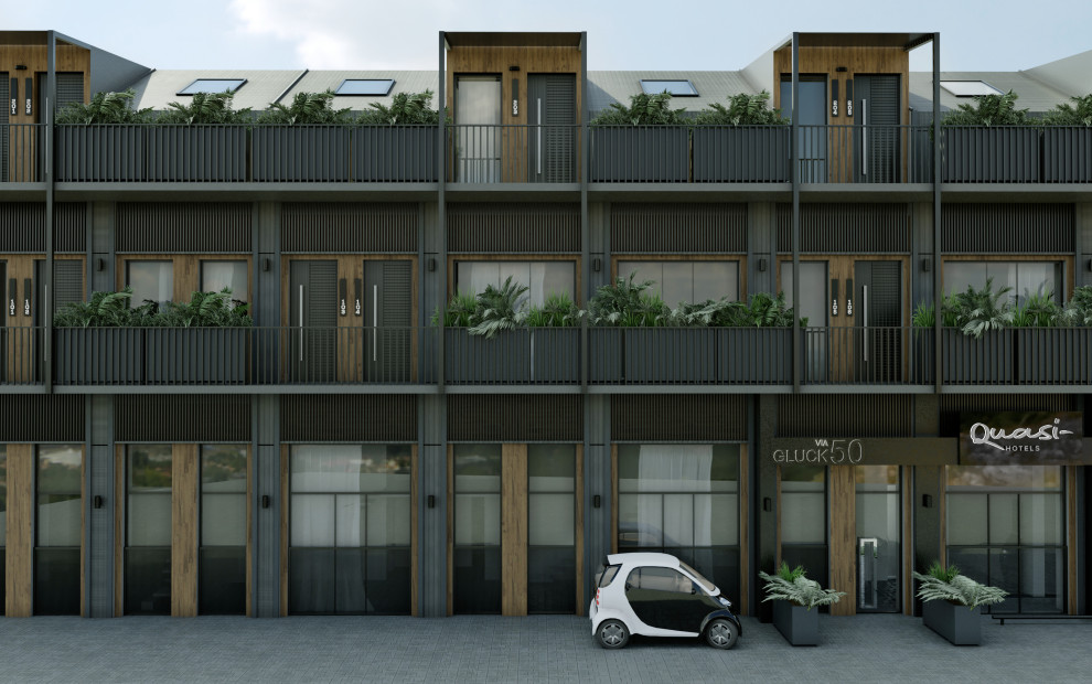 Inspiration för ett mycket stort funkis grått lägenhet, med tre eller fler plan, metallfasad, mansardtak och tak i metall