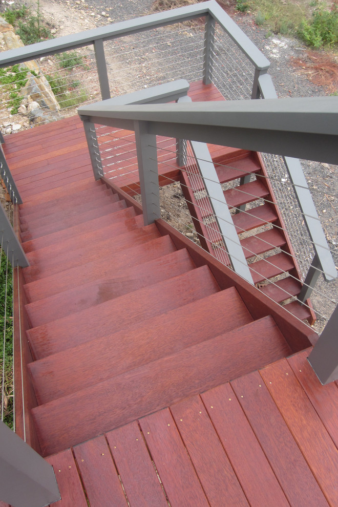 Design ideas for a large contemporary backyard deck in Canberra - Queanbeyan with no cover.