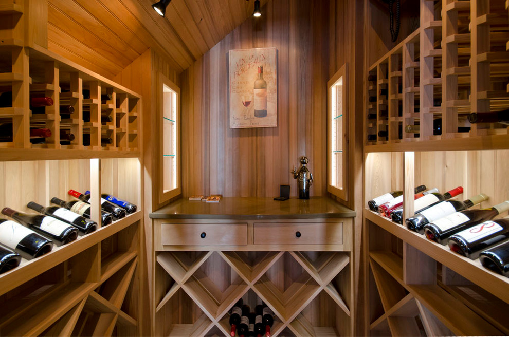Inspiration for a traditional wine cellar in Boston with display racks.