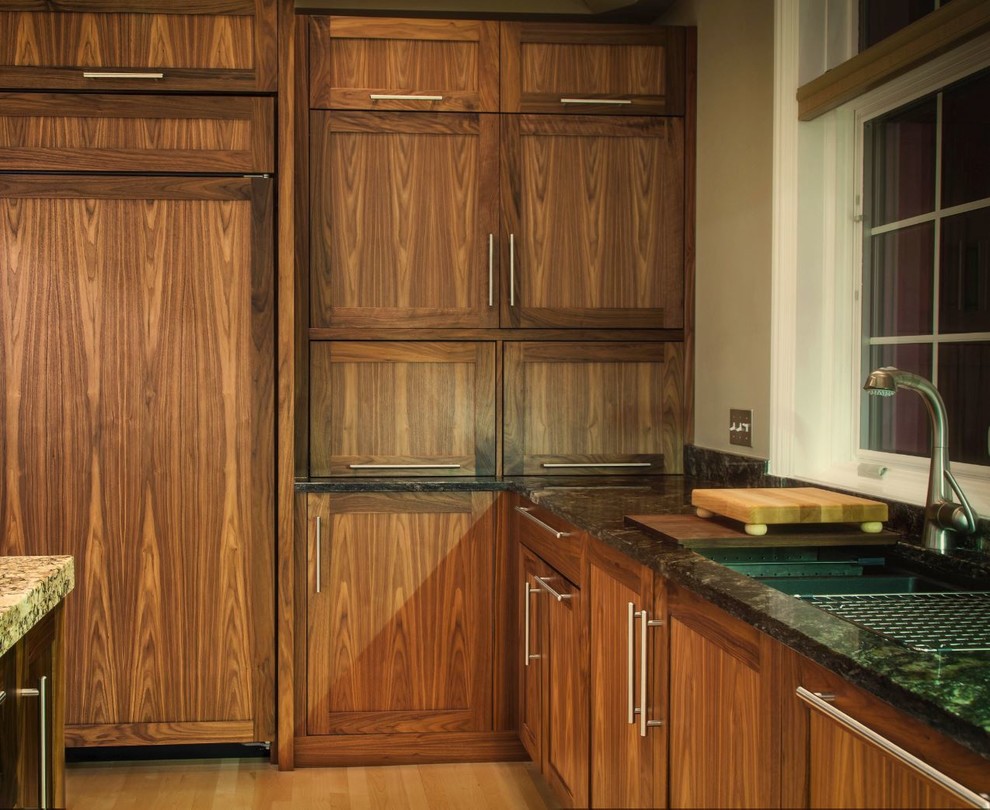 Inspiration for a large transitional u-shaped light wood floor eat-in kitchen remodel in Chicago with an undermount sink, recessed-panel cabinets, medium tone wood cabinets, granite countertops, green backsplash, stone slab backsplash, stainless steel appliances and an island