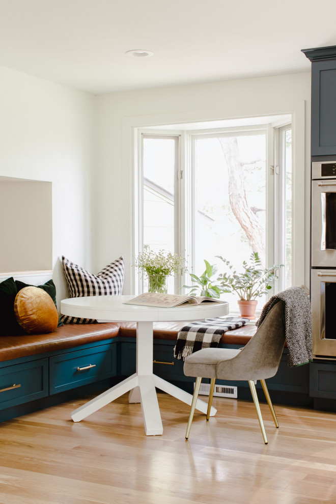 Great room - large transitional u-shaped medium tone wood floor great room idea in Denver with an undermount sink, shaker cabinets, blue cabinets, white backsplash, stainless steel appliances, an island and white countertops