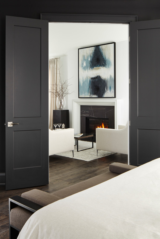 This is an example of a mid-sized transitional master bedroom in Toronto with black walls, medium hardwood floors and brown floor.