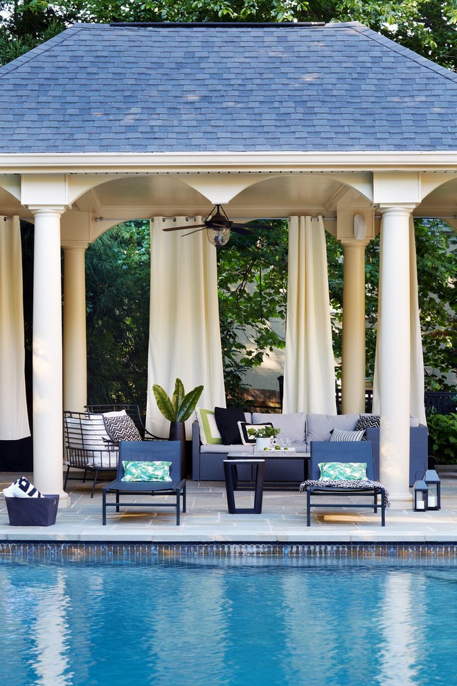 Design ideas for a transitional backyard patio in DC Metro with tile and a gazebo/cabana.
