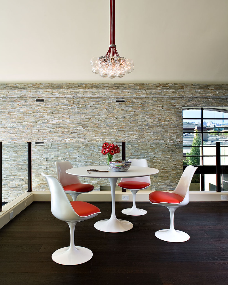 This is an example of a contemporary dining room in Los Angeles with dark hardwood floors.