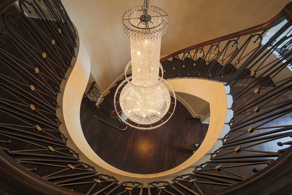 Design ideas for an expansive traditional wood curved staircase in Charlotte with painted wood risers.
