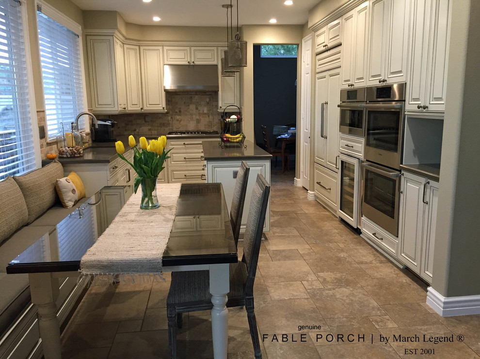 Example of a mid-sized transitional kitchen design with an island