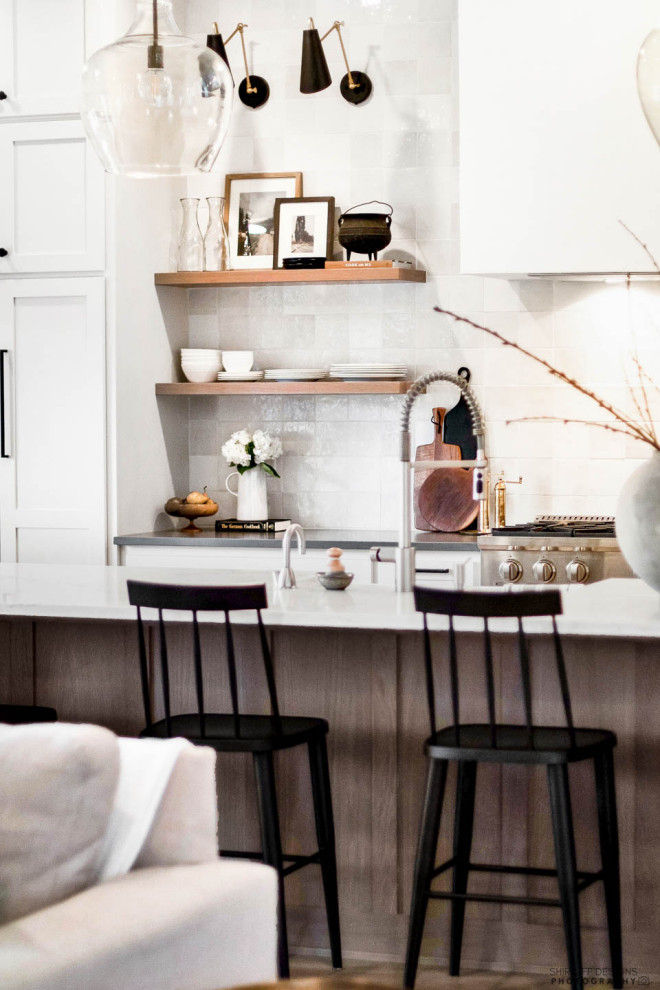 Inspiration for a large transitional single-wall eat-in kitchen in Other with a farmhouse sink, shaker cabinets, beige cabinets, quartz benchtops, grey splashback, ceramic splashback, stainless steel appliances, vinyl floors, with island, beige floor and white benchtop.