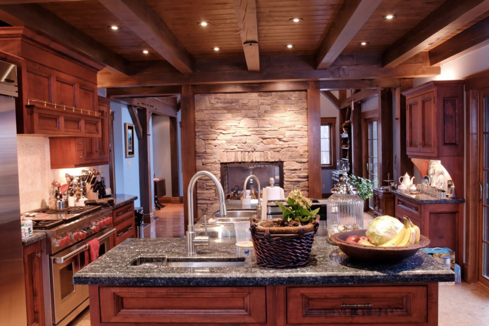 Mid-sized mountain style galley ceramic tile open concept kitchen photo in Boston with shaker cabinets, white cabinets, granite countertops, stainless steel appliances, an island and a double-bowl sink