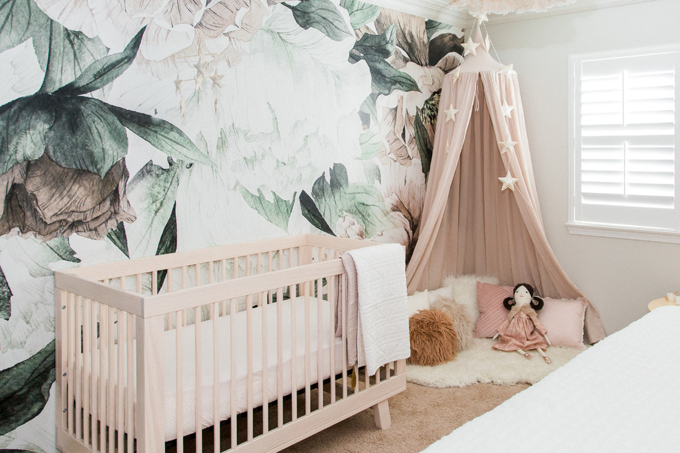 Scandinavian nursery in San Diego with white walls, carpet and brown floor for girls.