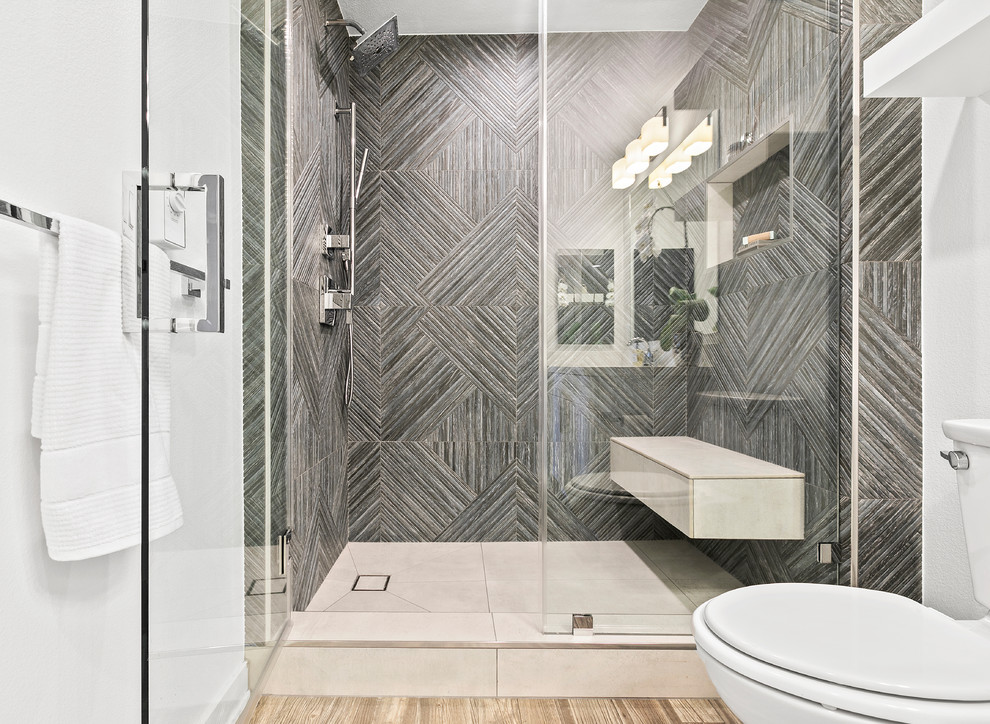 Design ideas for a mid-sized transitional kids bathroom in Los Angeles with a corner tub, gray tile, porcelain tile and white walls.