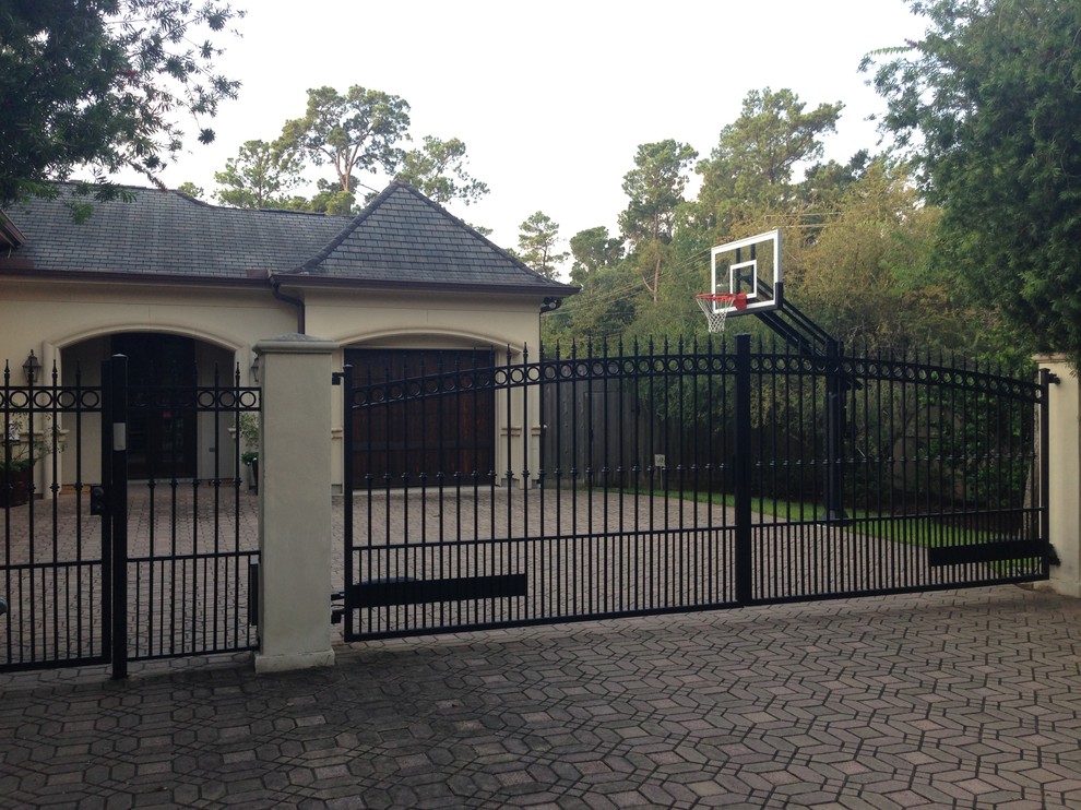 Photo of a large traditional front yard partial sun outdoor sport court in Houston.
