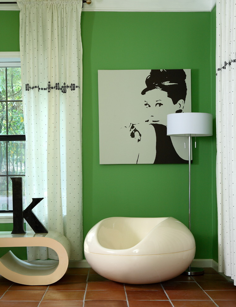 Design ideas for a large eclectic guest bedroom in Atlanta with green walls, terra-cotta floors and no fireplace.