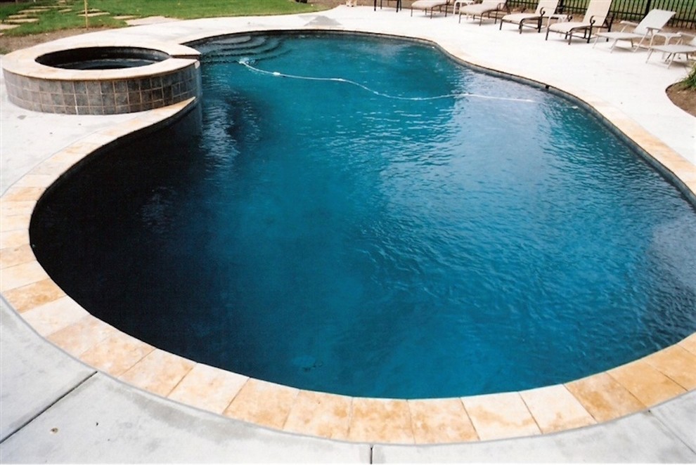 Mid-sized backyard concrete paver and custom-shaped lap hot tub photo in Baltimore