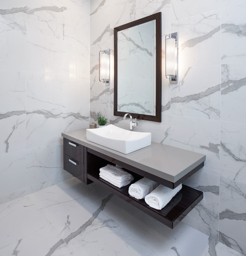 Photo of a large contemporary master bathroom in Detroit with flat-panel cabinets, brown cabinets, a freestanding tub, a curbless shower, a one-piece toilet, white tile, marble, white walls, marble floors, a pedestal sink, concrete benchtops, white floor and a hinged shower door.