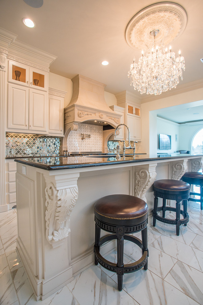 Inspiration for an expansive traditional single-wall open plan kitchen in New Orleans with a drop-in sink, louvered cabinets, white cabinets, granite benchtops, metallic splashback, mirror splashback, stainless steel appliances, ceramic floors, multiple islands and white floor.