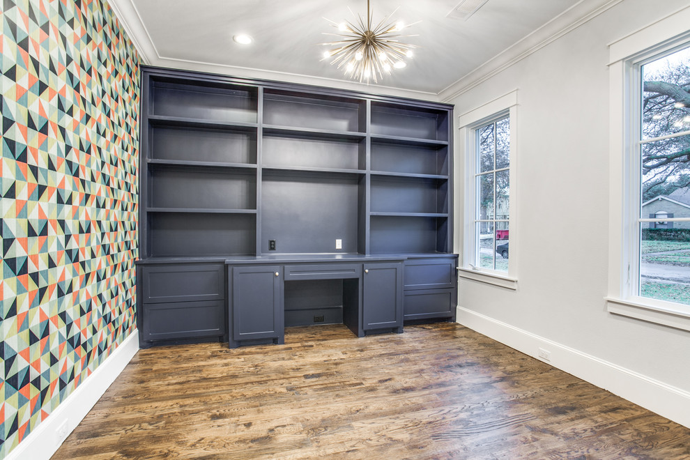 Inspiration for a mid-sized traditional study room in Dallas with grey walls, medium hardwood floors, a built-in desk and brown floor.