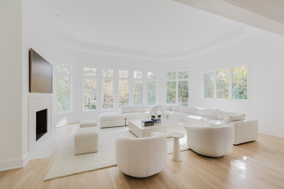 Spacious Modern Living Room with White Furniture and Large Windows