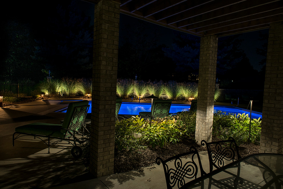 Inspiration for a mid-sized backyard concrete and rectangular pool remodel