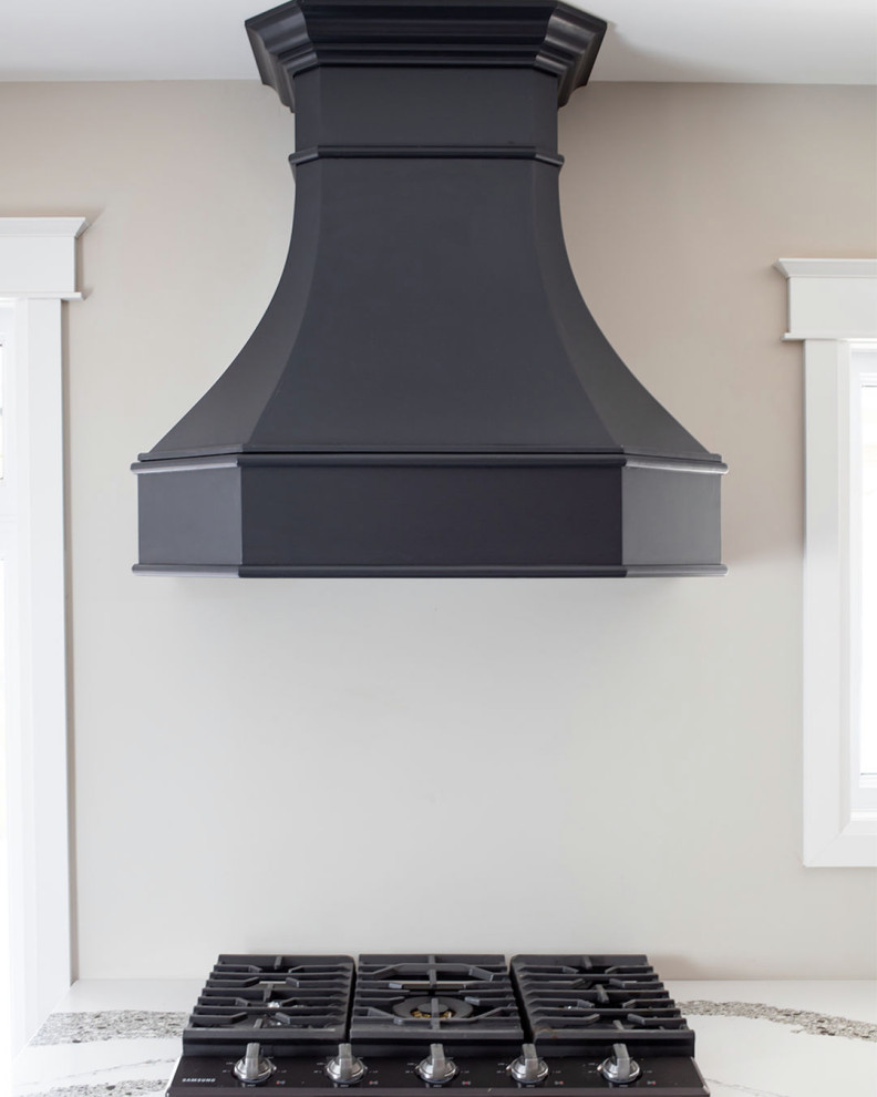 Example of a transitional kitchen design in Toronto