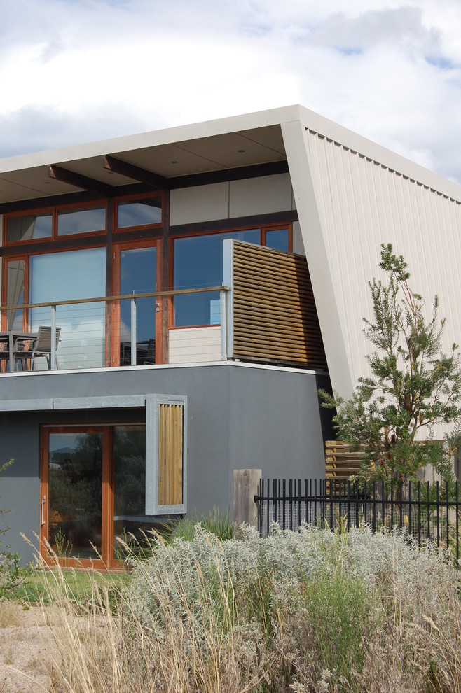 This is an example of a mid-sized contemporary two-storey exterior in Other.