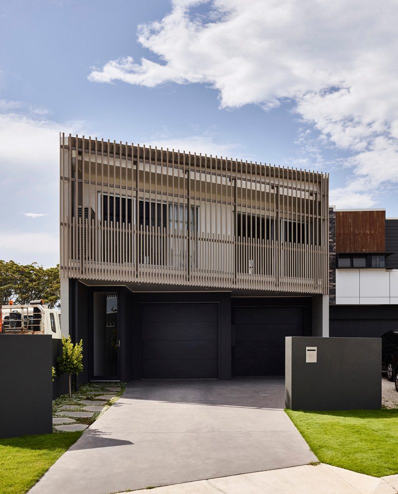 Design ideas for a small contemporary two-storey black exterior in Sunshine Coast.