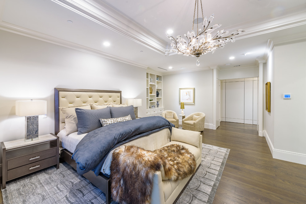 Large transitional master bedroom in Dallas with grey walls, medium hardwood floors, no fireplace and brown floor.
