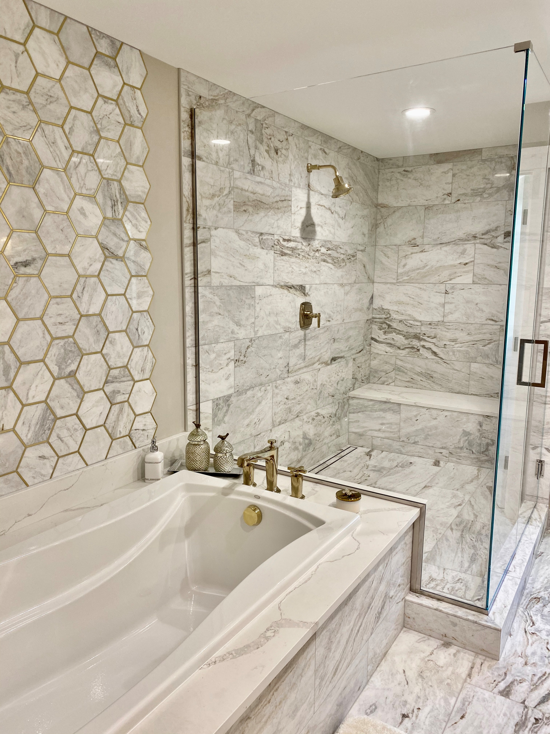 marble tile bathroom with French gold accents