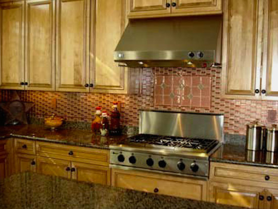 Transitional ceramic tile kitchen photo in Phoenix with medium tone wood cabinets, granite countertops, stainless steel appliances and an island